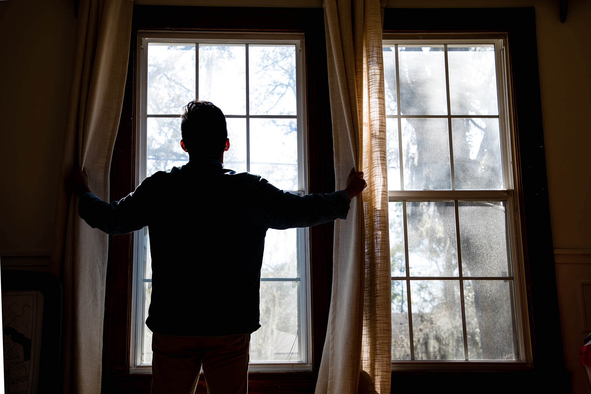 A man in front of a window