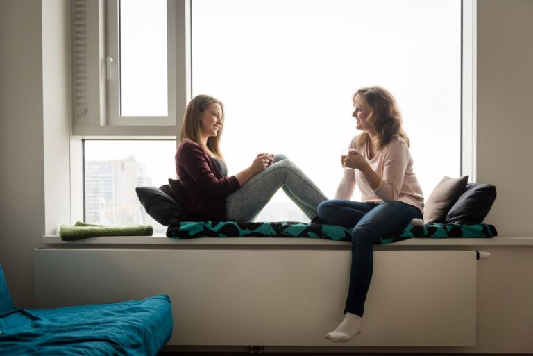 A woman and her daughter talk about leaving the cell phone at home.