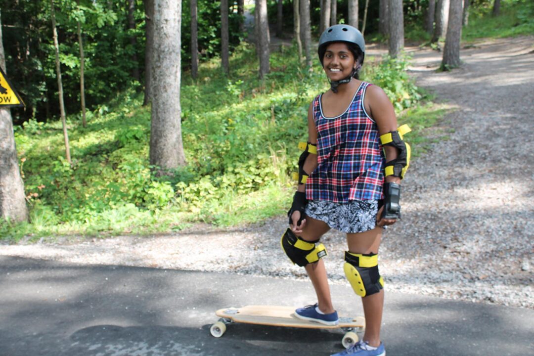 a young woman and a longboard