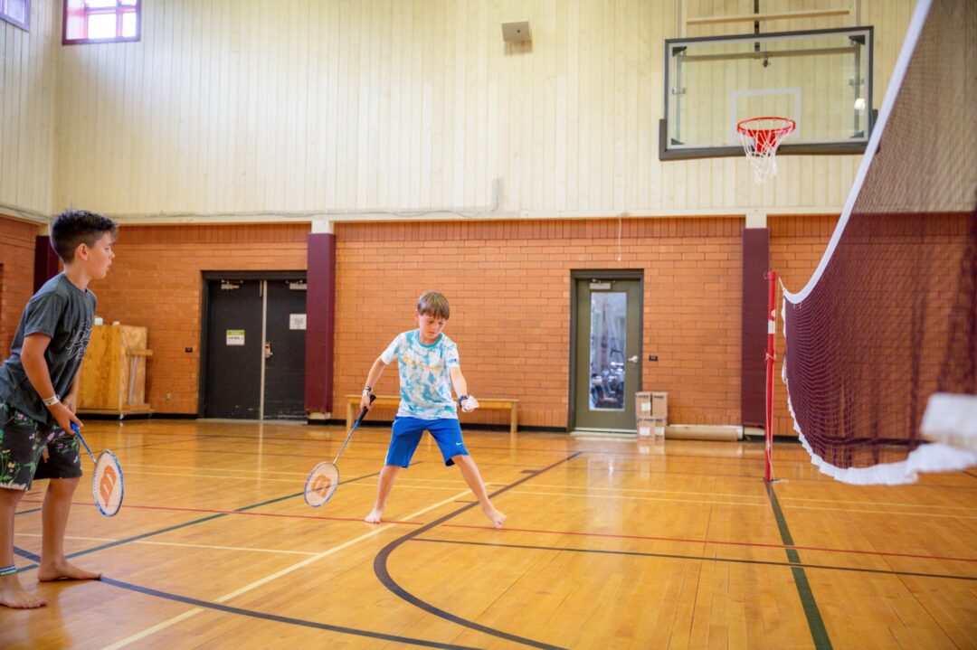 two boys playing badminton