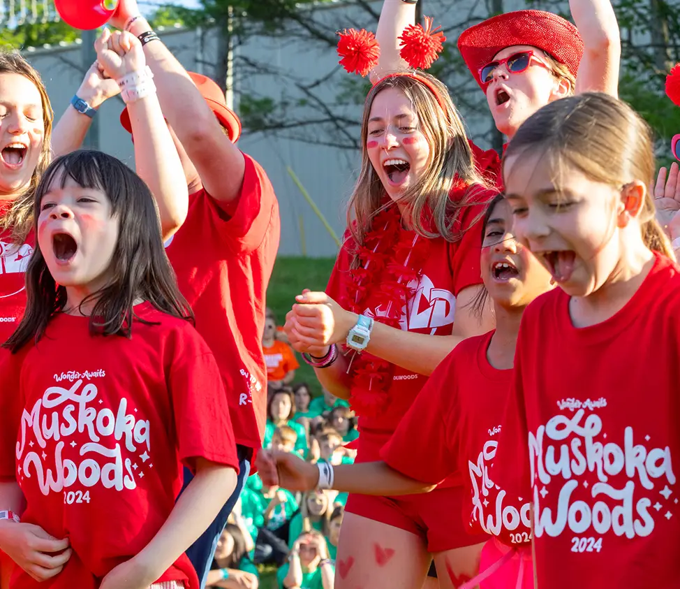 Three young kids in red shirts